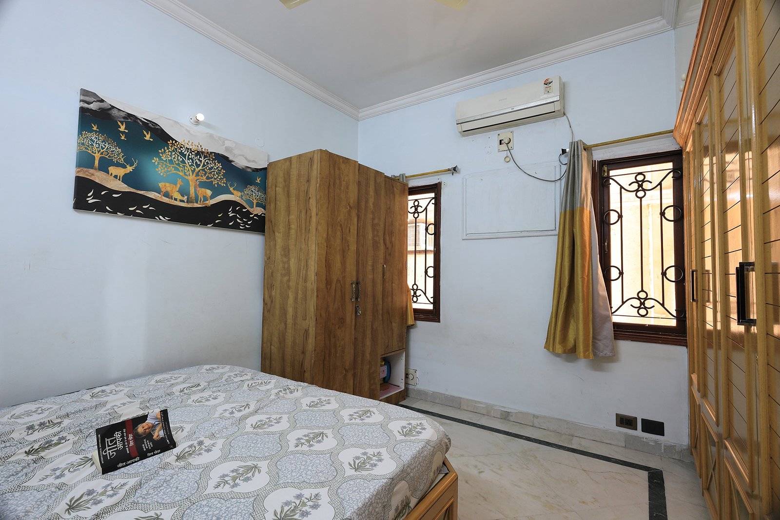 Bedroom 3 with wardrobe, windows, and AC