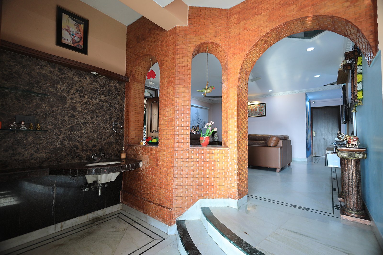 Brick archway opening from the dining room through to the living room