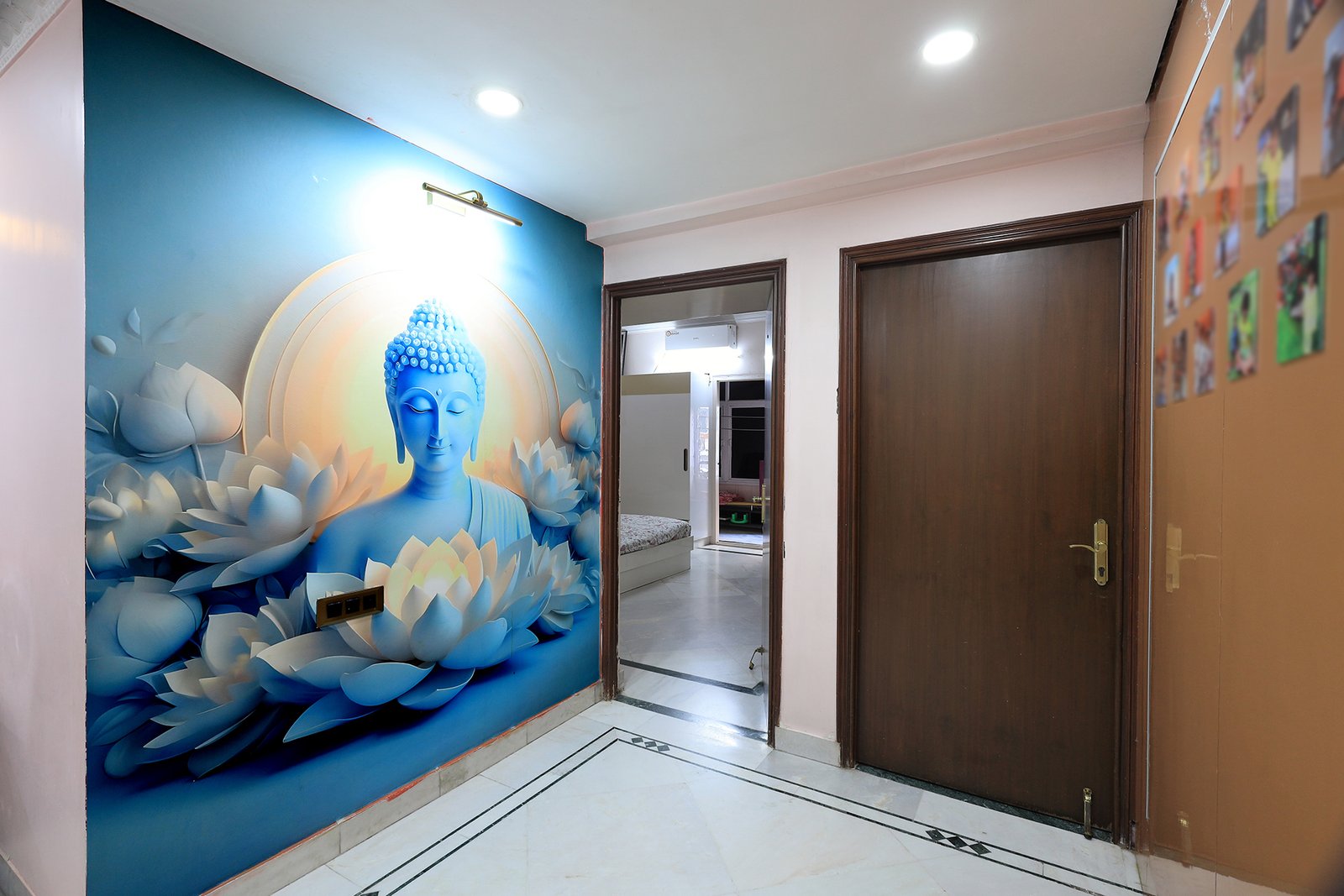 Buddha wall mural along the hallway leading to the bedrooms